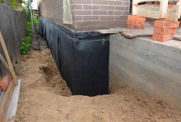 SJ Waterproofing Pros technician performing targeted Waterproofing assessment in Servia, IN